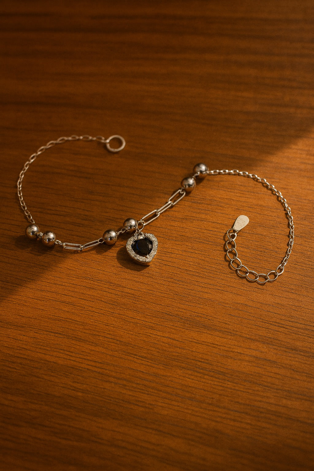 Elegant Heart-Shaped Blue Stone Silver Bracelet with Crystal Accents.