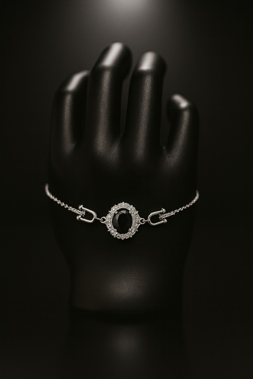 "Elegant Black Oval Stone Bracelet with Sparkling Halo Accents"