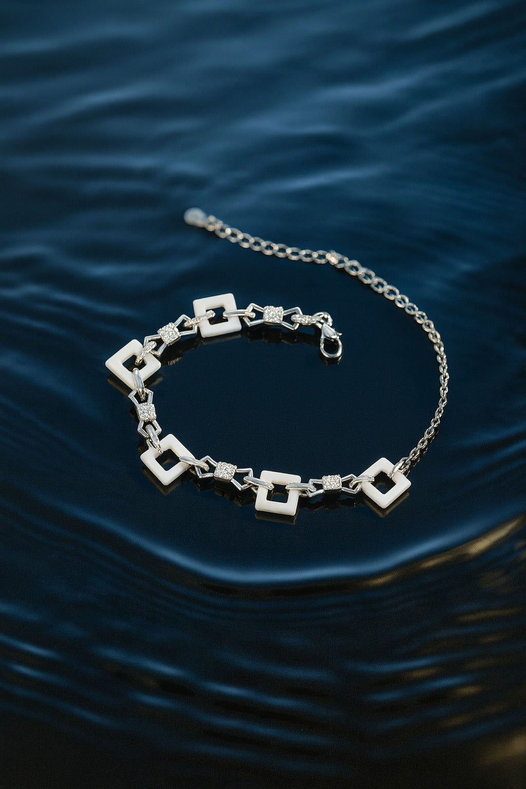 "Elegant Geometric Silver Bracelet with White Square Links & Sparkling Accents"