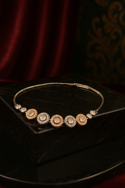 "Elegant Dual-Tone Bracelet with Crystal-Studded Circular Charms"
