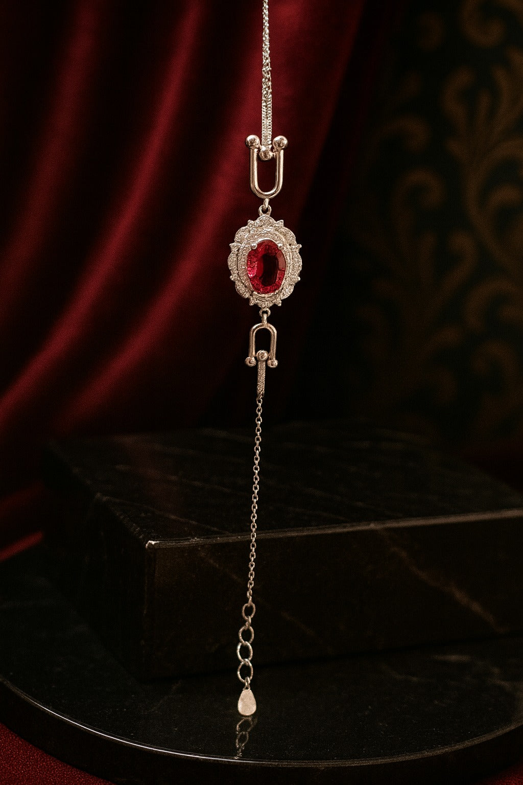 "Elegant Silver Bracelet with Pink Oval Gemstone and Diamond Halo"