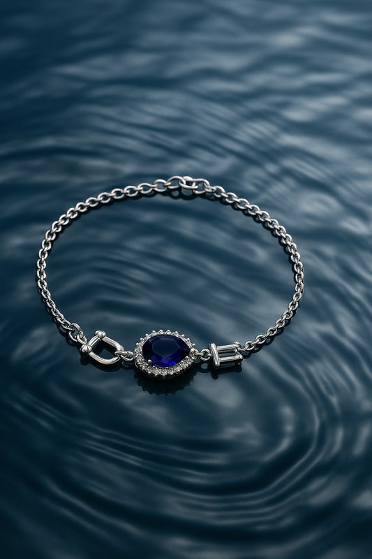 “Elegant Silver Bracelet with Teardrop Blue Stone & Crystal Accents”