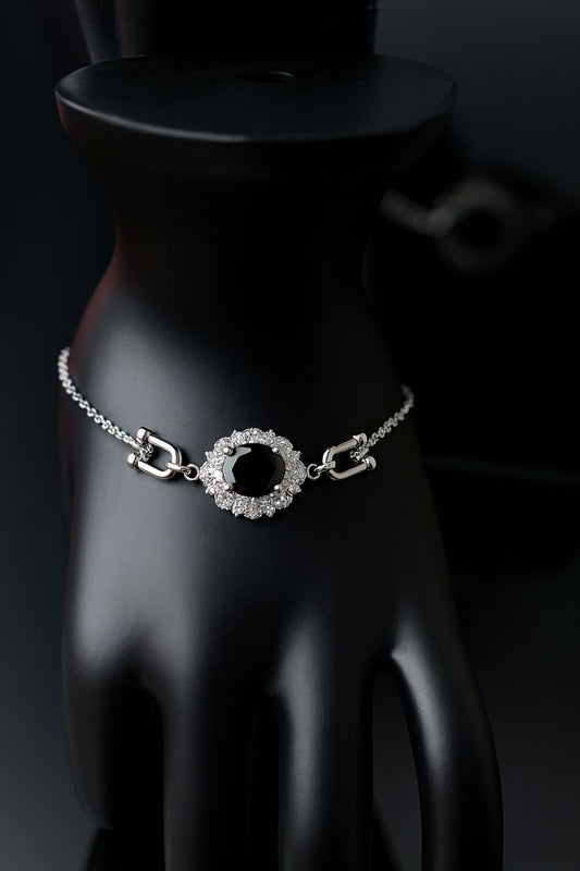 "Elegant Black Oval Stone Bracelet with Sparkling Halo Accents"