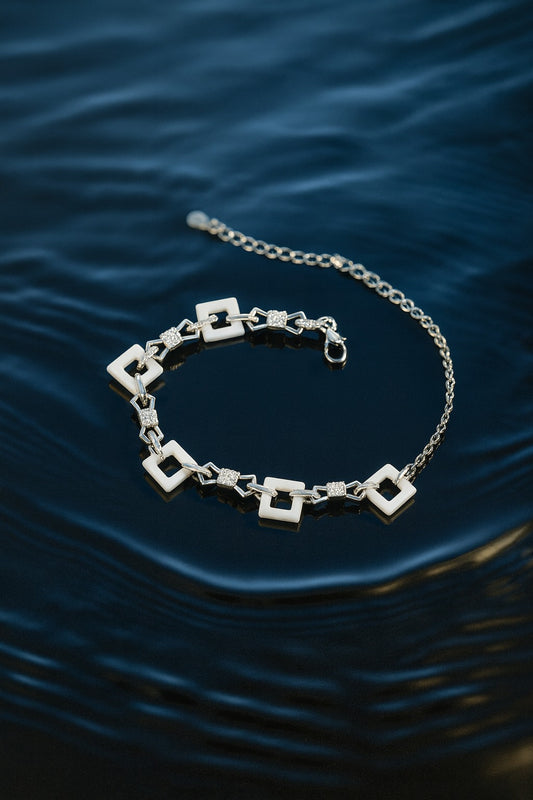 "Elegant Geometric Silver Bracelet with White Square Links & Sparkling Accents"