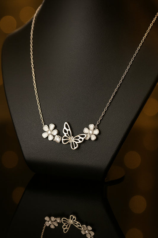 "Charming Silver Chain with Butterfly Motif and Floral Accents Adorned with Crystals"