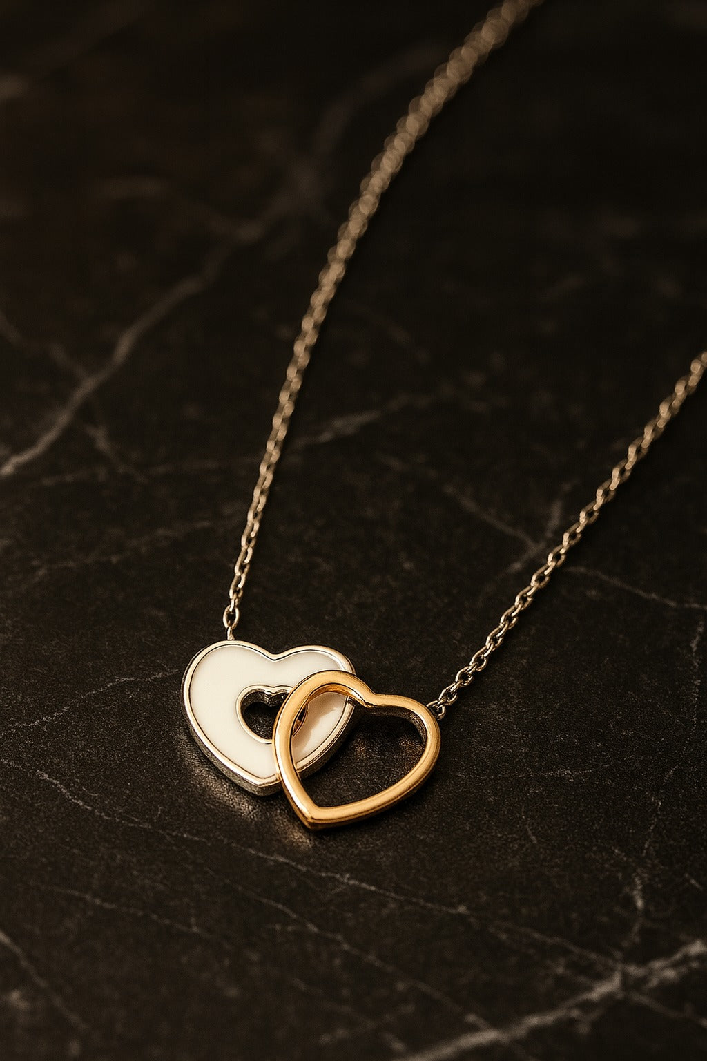 “Elegant Silver Chain with Dual Interlocking Heart Pendant”